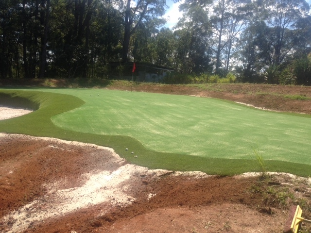 The fringe grass adds a nice finish touch to the golf green.