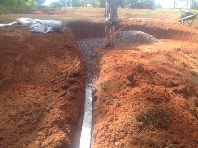 Adding drainage pipes to the bunker to give water a place to go.
