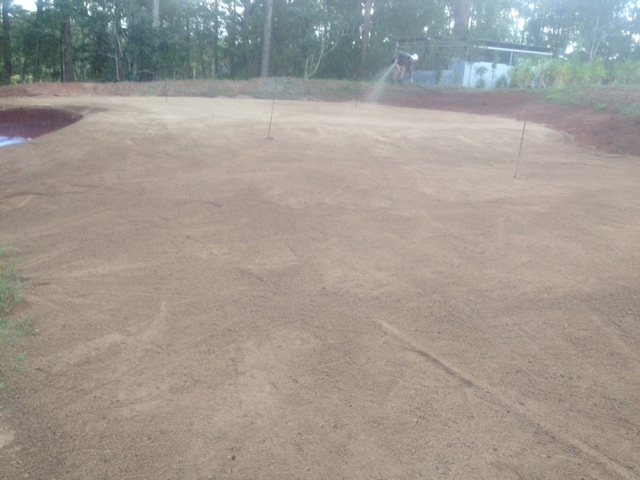 The making of a golf green. Bunker and green shaping almost complete