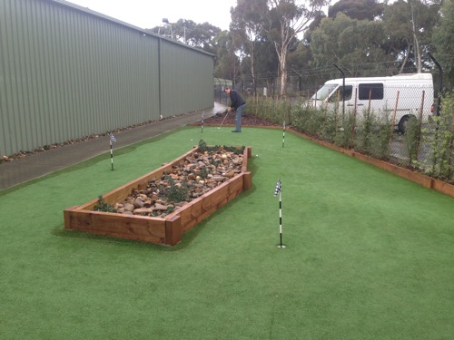 All weather synthetic golf green